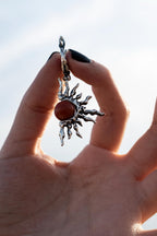 Handmade sterling silver sun earrings with red coral center