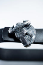 Handcrafted sterling silver bull head belt buckle on leather strap