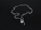 Handcrafted sterling silver padlock necklace with key charm