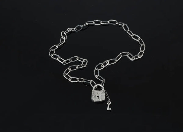 Handcrafted sterling silver padlock necklace with key charm
