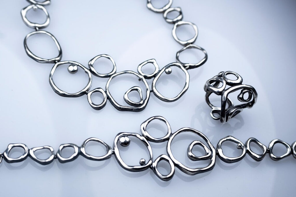 Handcrafted Air Element sterling silver jewelry set with abstract design