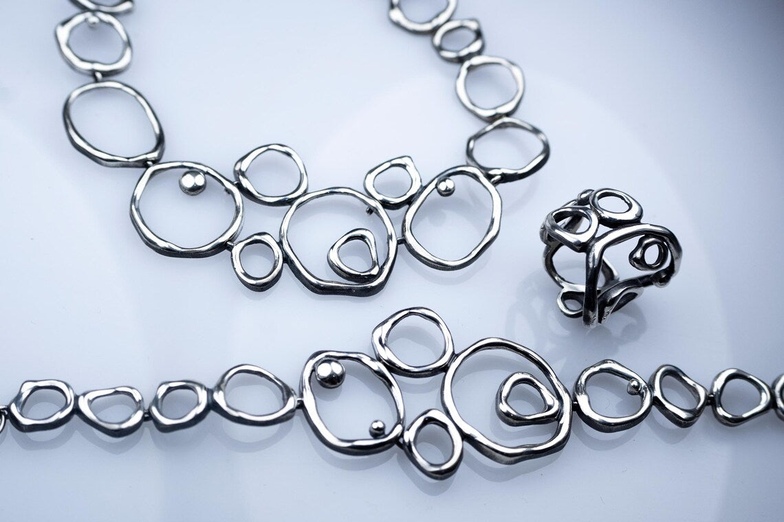Handcrafted Air Element sterling silver jewelry set with abstract design