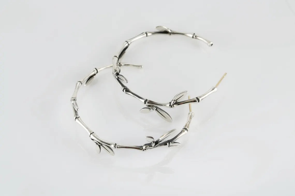 Sterling silver bamboo leaf hoop earrings with botanical design