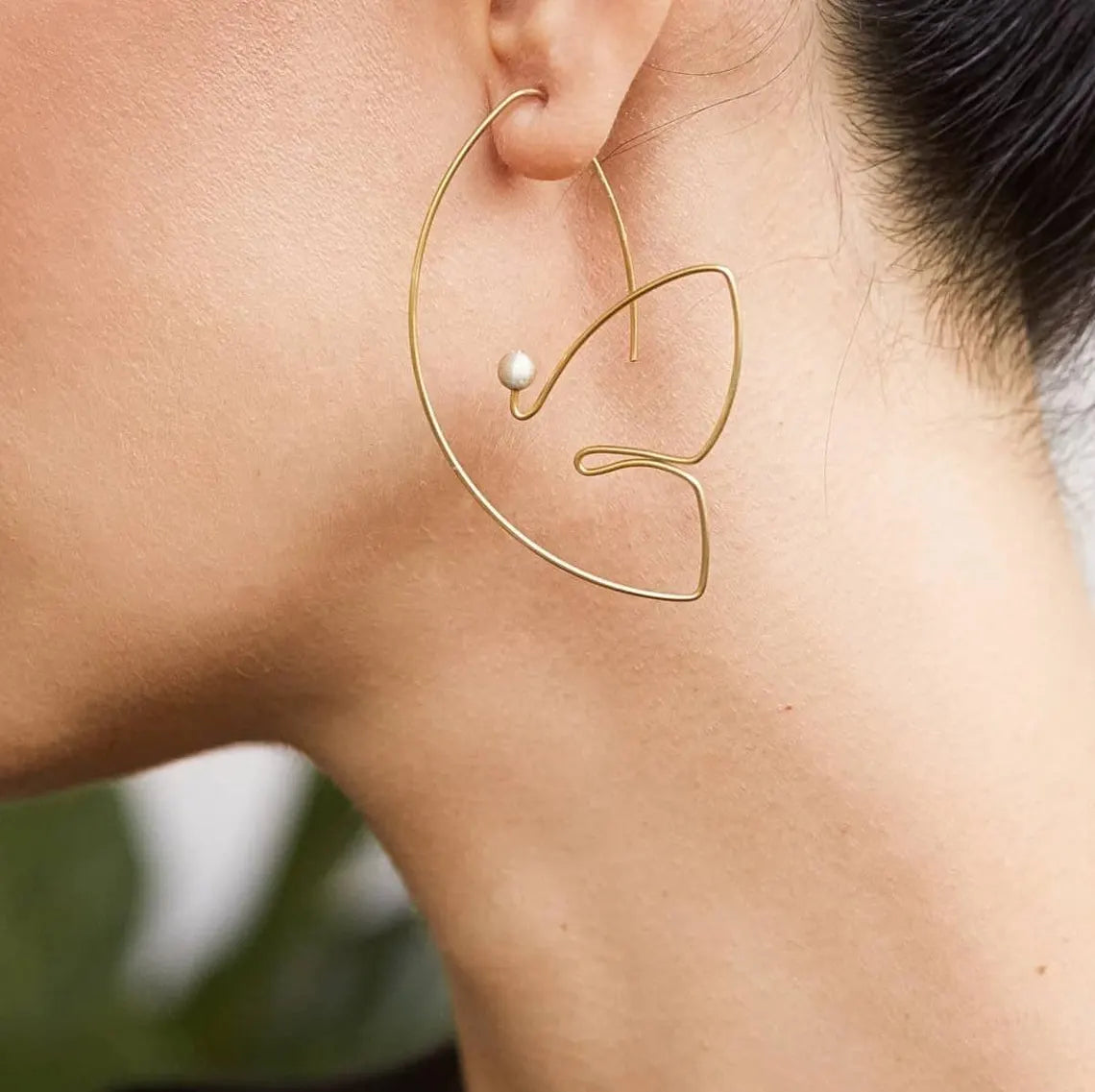 Modern statement earrings in sterling silver with abstract portrait style