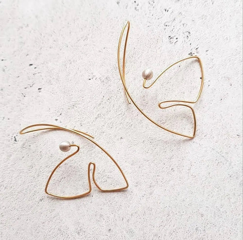 Minimalist line art earrings with artistic butterfly-inspired design