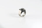 Bold serpent-inspired silver ring with brutalist styling