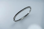 Silver bracelet on a light gray background