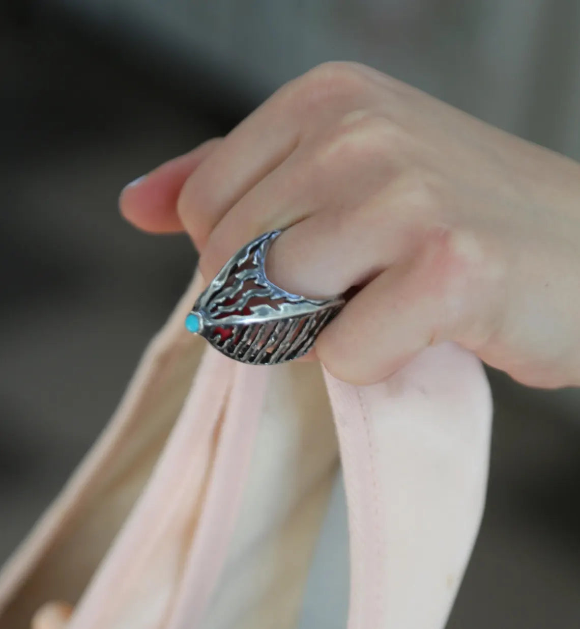Sculptural sterling silver ring with red coral accent