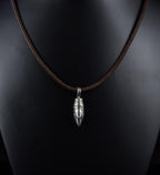 Tribal engraved bullet pendant