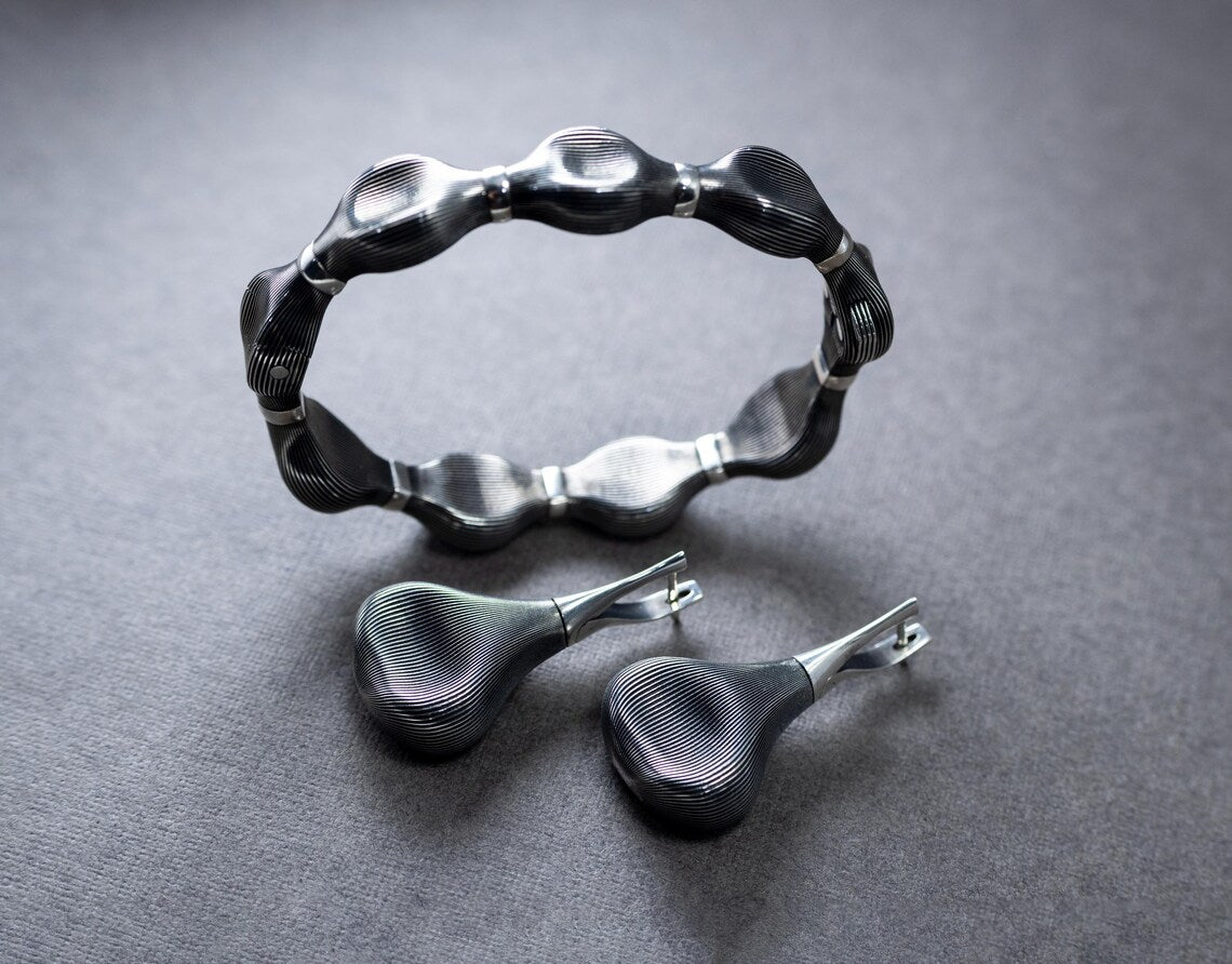 Sculptural wave inspired silver jewelry set with oxidized finish