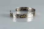 Symbolic silver cuff bracelet