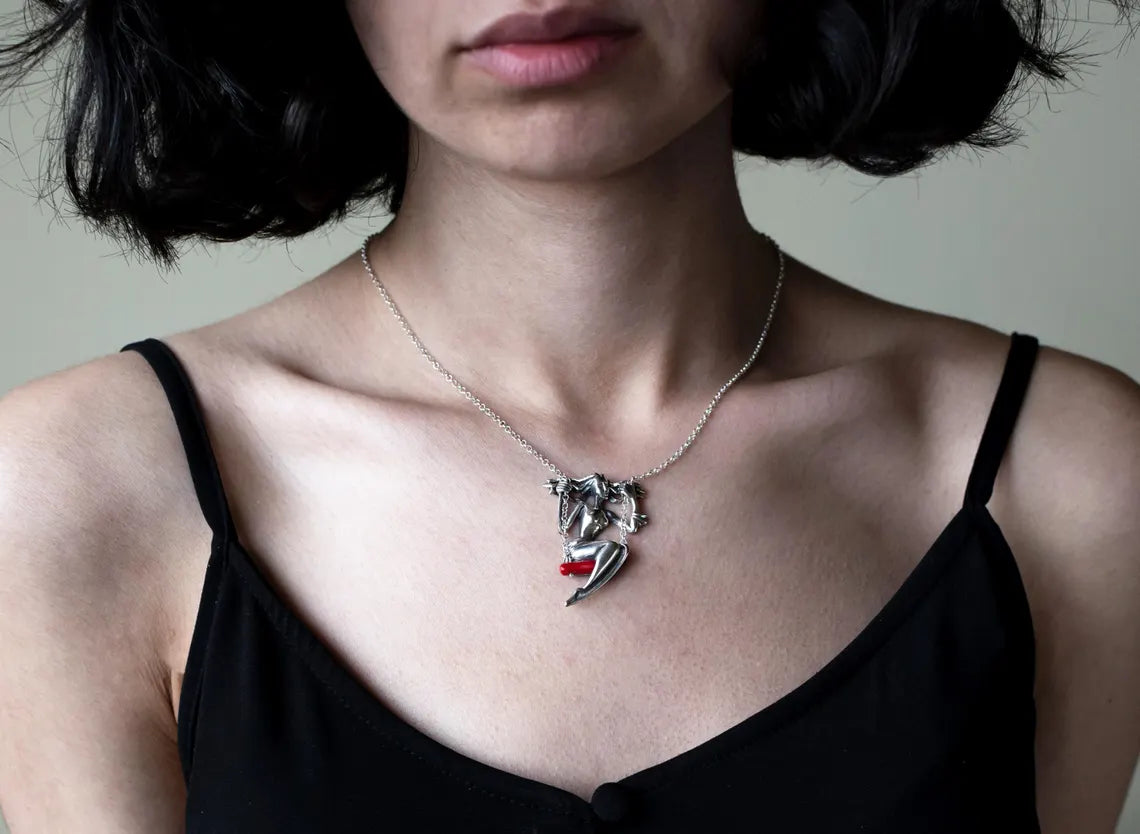 Handmade sterling silver woman on swing pendant