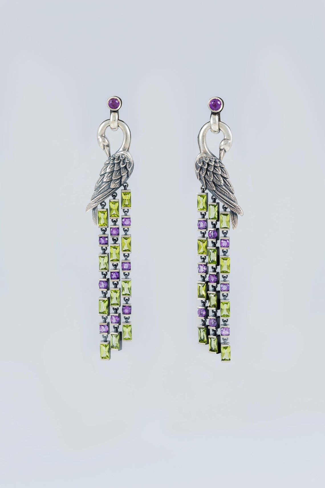 Handcrafted sterling silver Firebird earrings with peridot and amethyst
