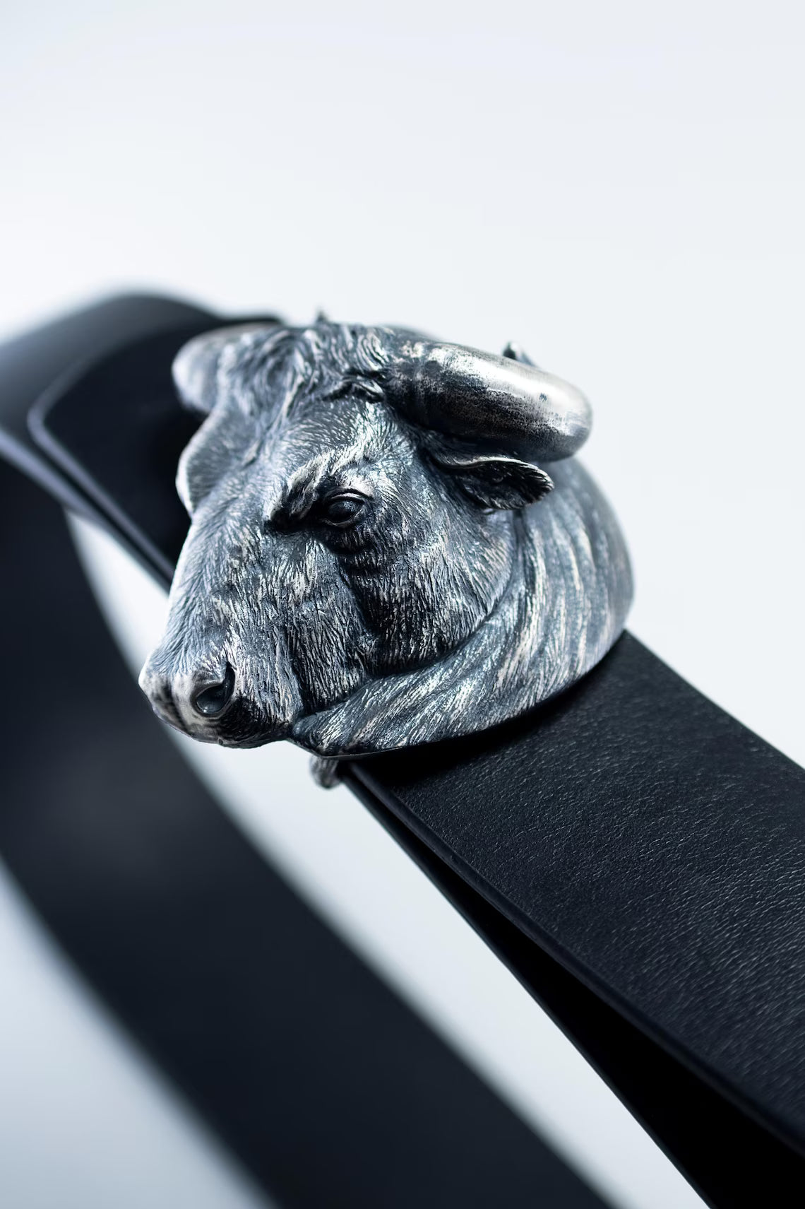 Western cowboy belt with bold silver bull design
