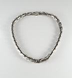 Textured chunky silver necklace on model