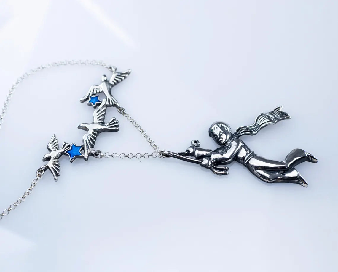 Boy and birds sterling silver pendant detail