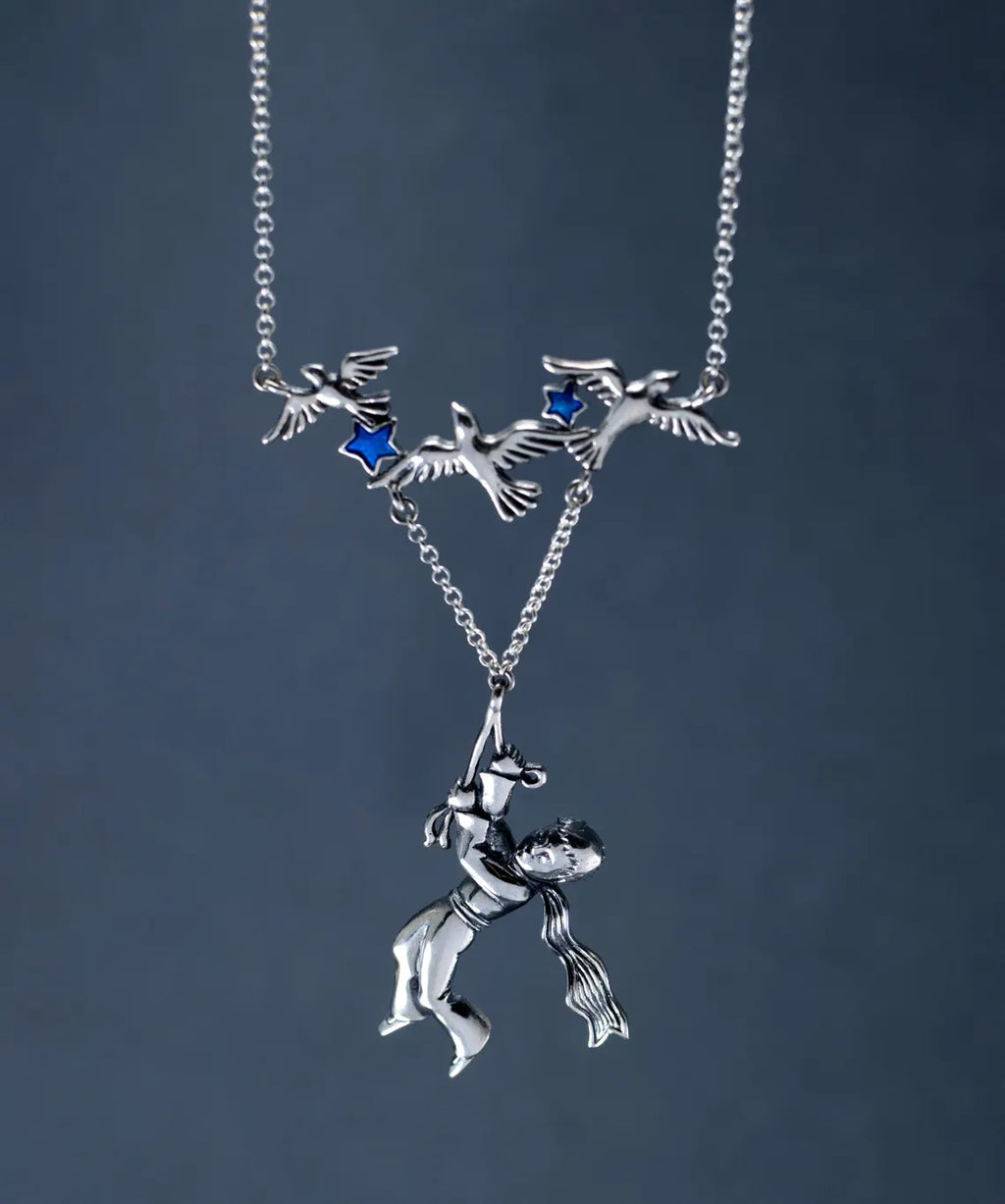 Artisan sterling silver fantasy pendant
Boy and birds silver statement necklace