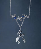 Artisan sterling silver fantasy pendant
Boy and birds silver statement necklace