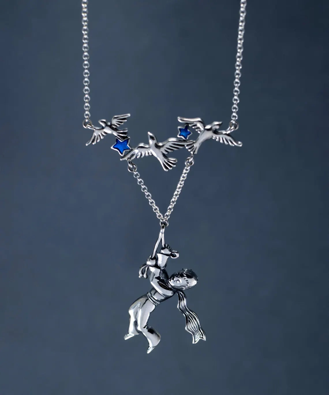 Artisan sterling silver fantasy pendant
Boy and birds silver statement necklace