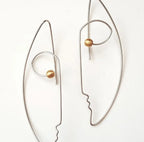 Handcrafted sterling silver face line art earrings with gold bead