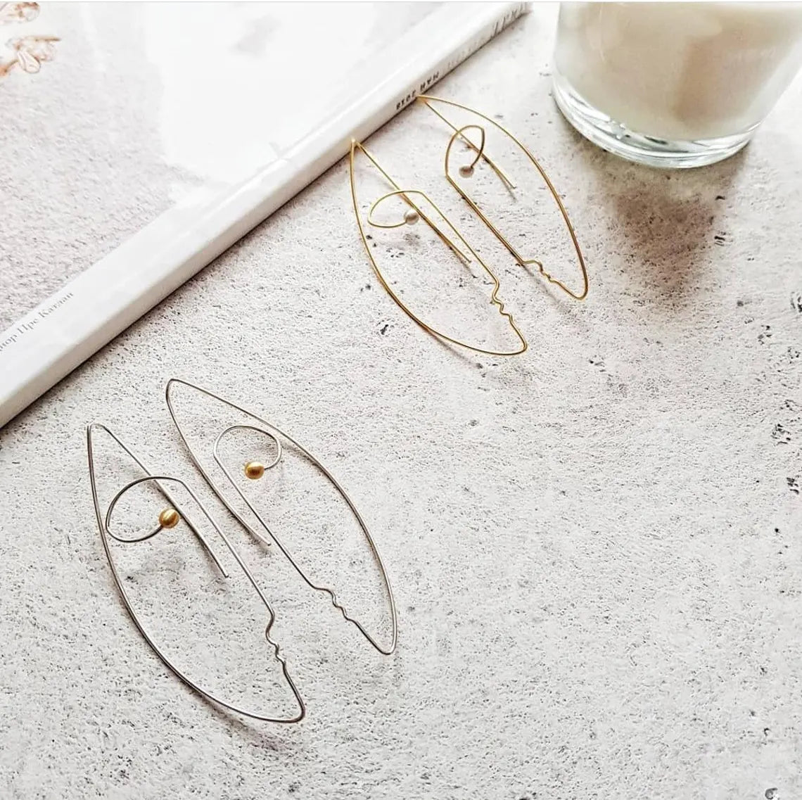 Abstract wire art earrings featuring minimalist face outline design