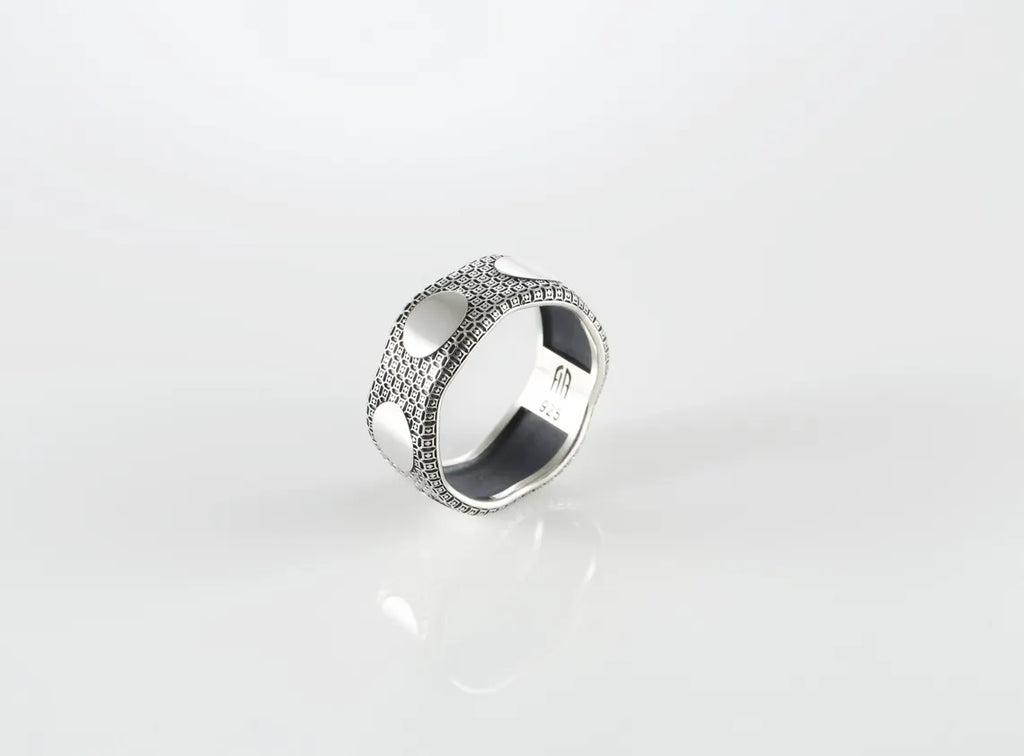 Men’s sterling silver textured ring with brushed oval detail