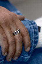 Oxidized silver ring with red enamel detail