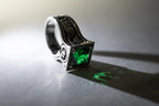 Art Nouveau crane ring with green emerald stone