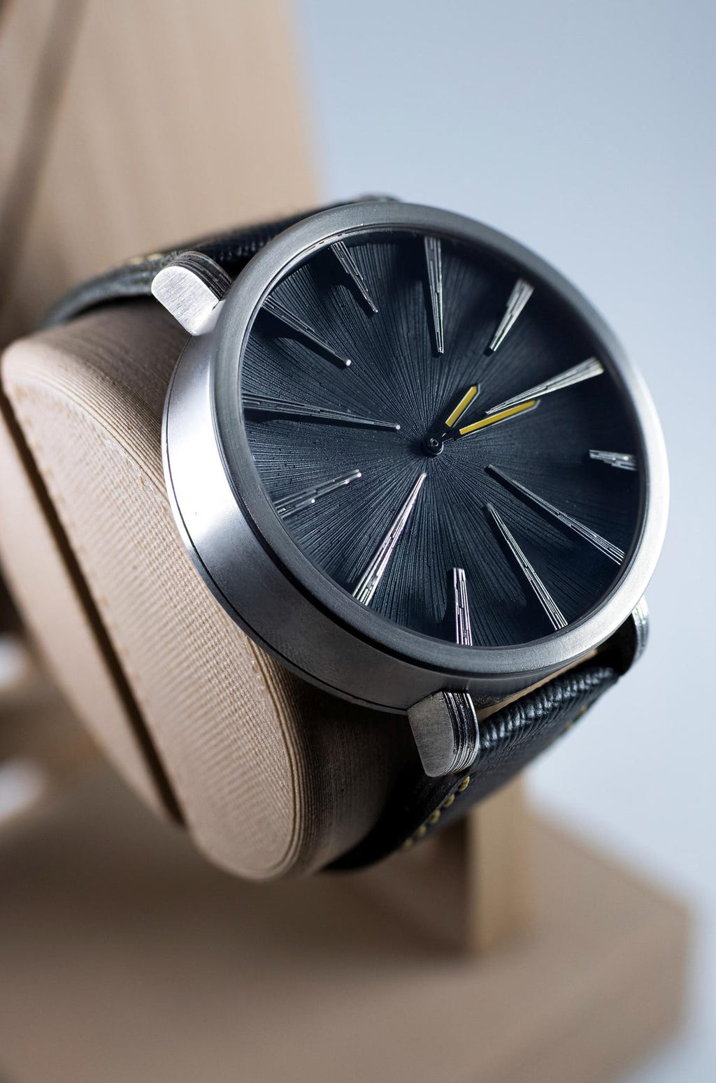 Modern silver case wristwatch with sunburst black dial