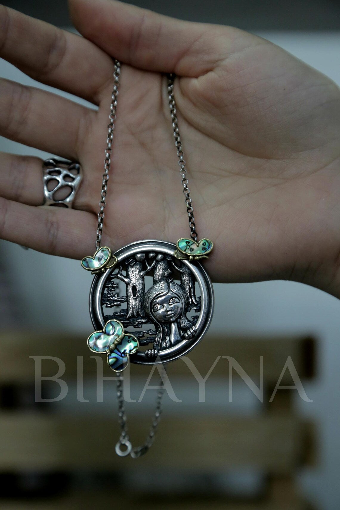 Nature inspired artisan silver pendant