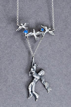 Celestial silver necklace with blue enamel stars