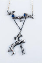 Storybook inspired silver pendant close-up
