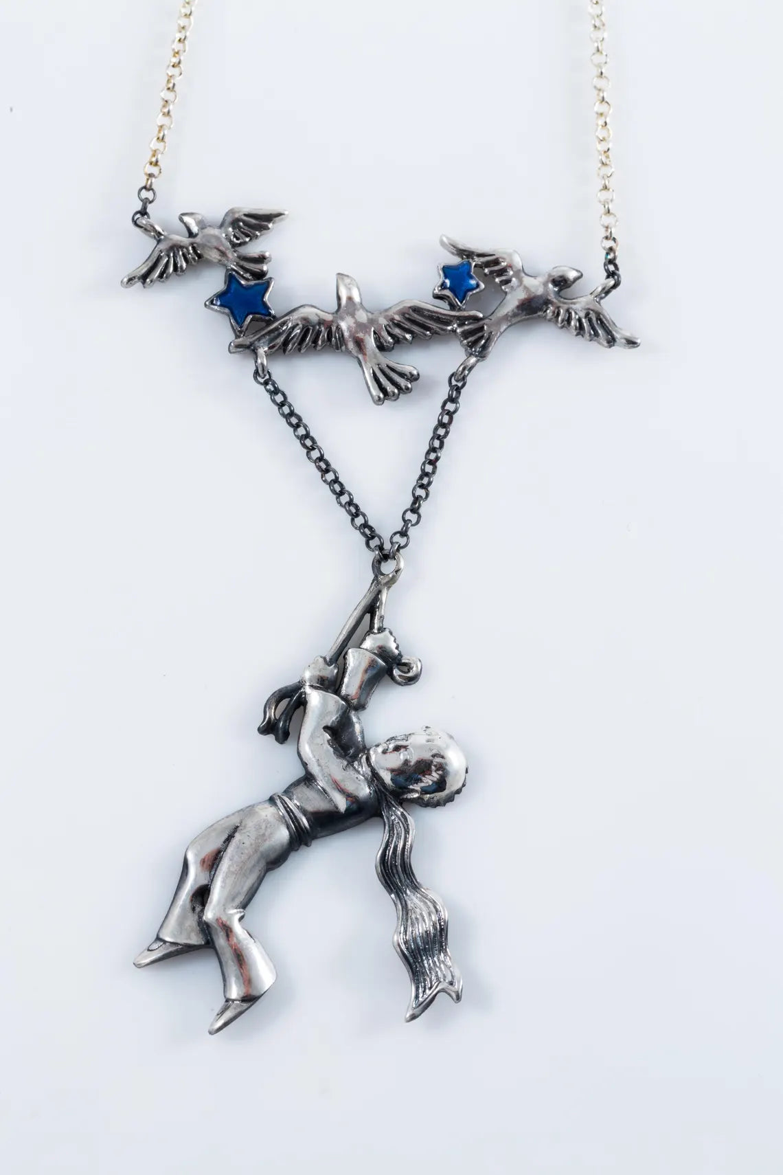 Storybook inspired silver pendant close-up