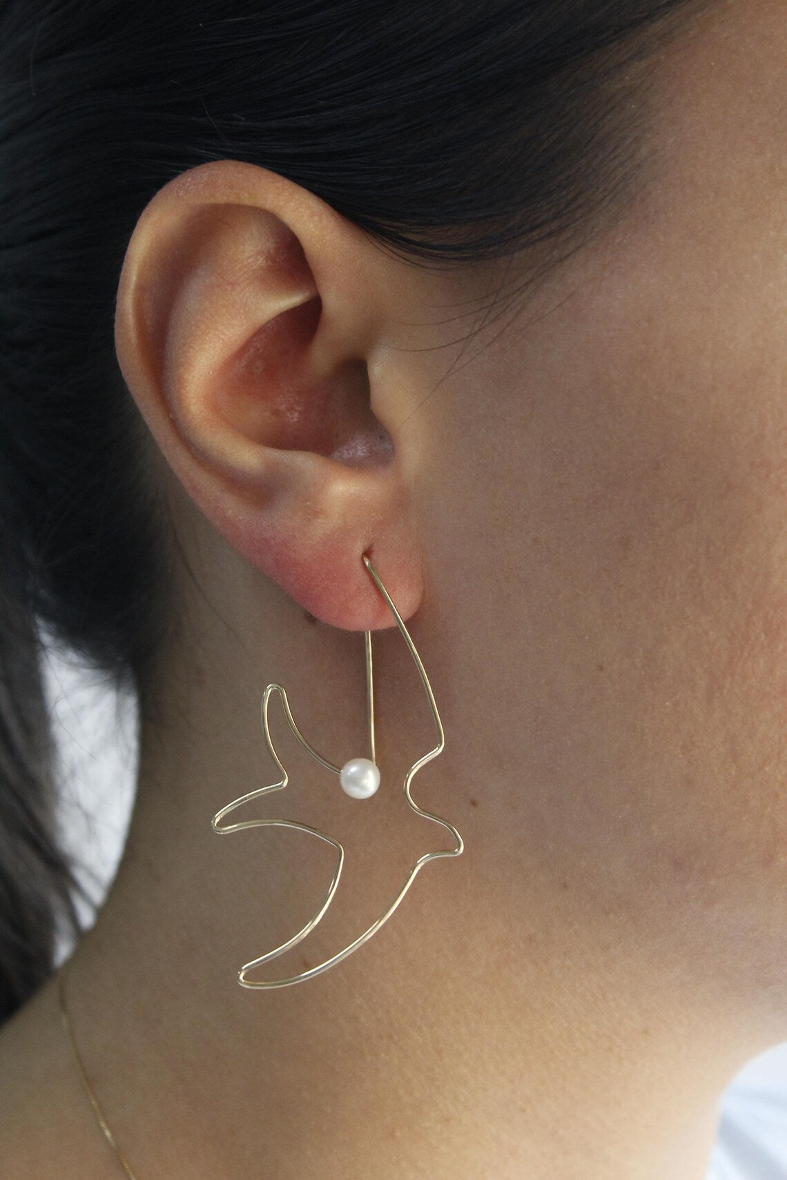 Nature-inspired sterling silver earrings featuring elegant pearls