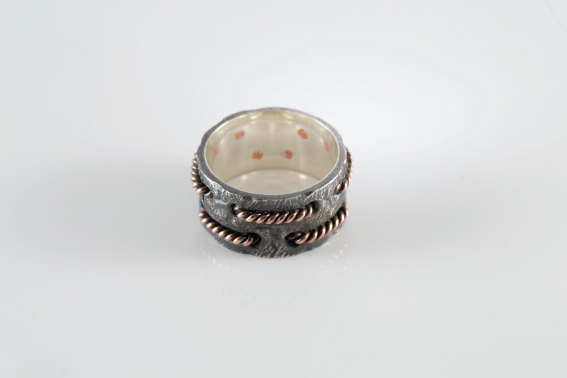 Oxidized silver statement ring with copper wire inlay detail