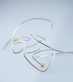 Minimalist fish-shaped dangle earrings made from sterling silver