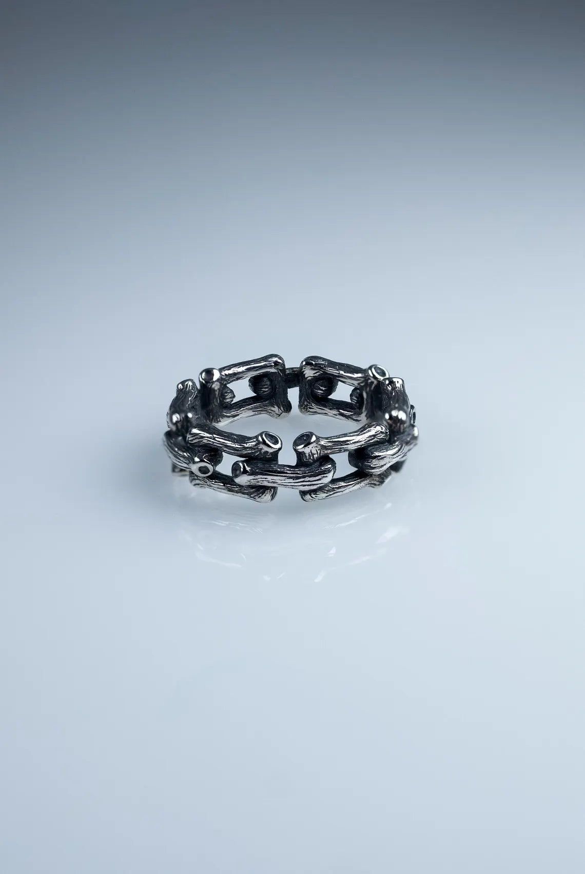 Textured silver chain earrings close-up