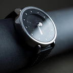 Wristwatch with a minimalist design on a dark background