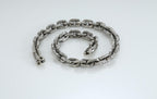 Bold silver chain necklace with anchor pendant close-up