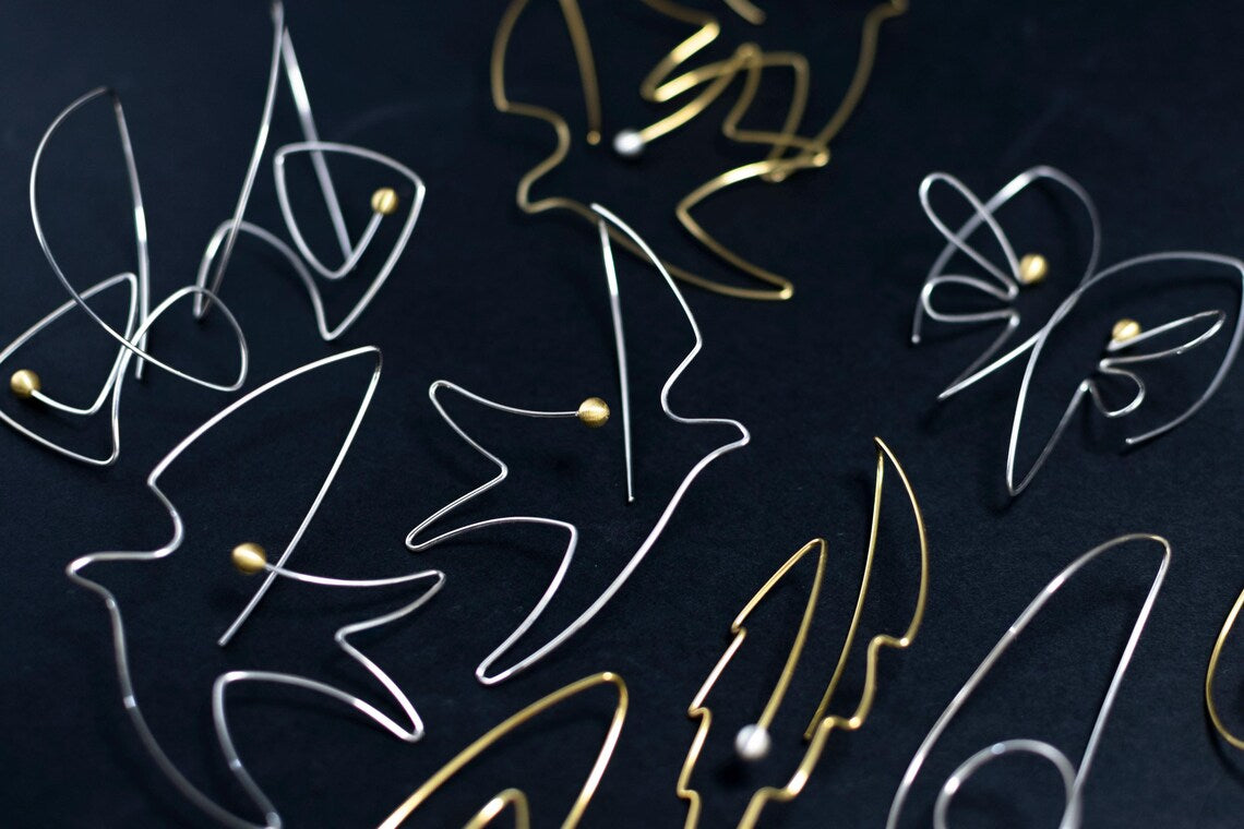 Handcrafted bird motif silver earrings