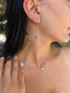 Minimalist wire bird dangle earrings made from sterling silver