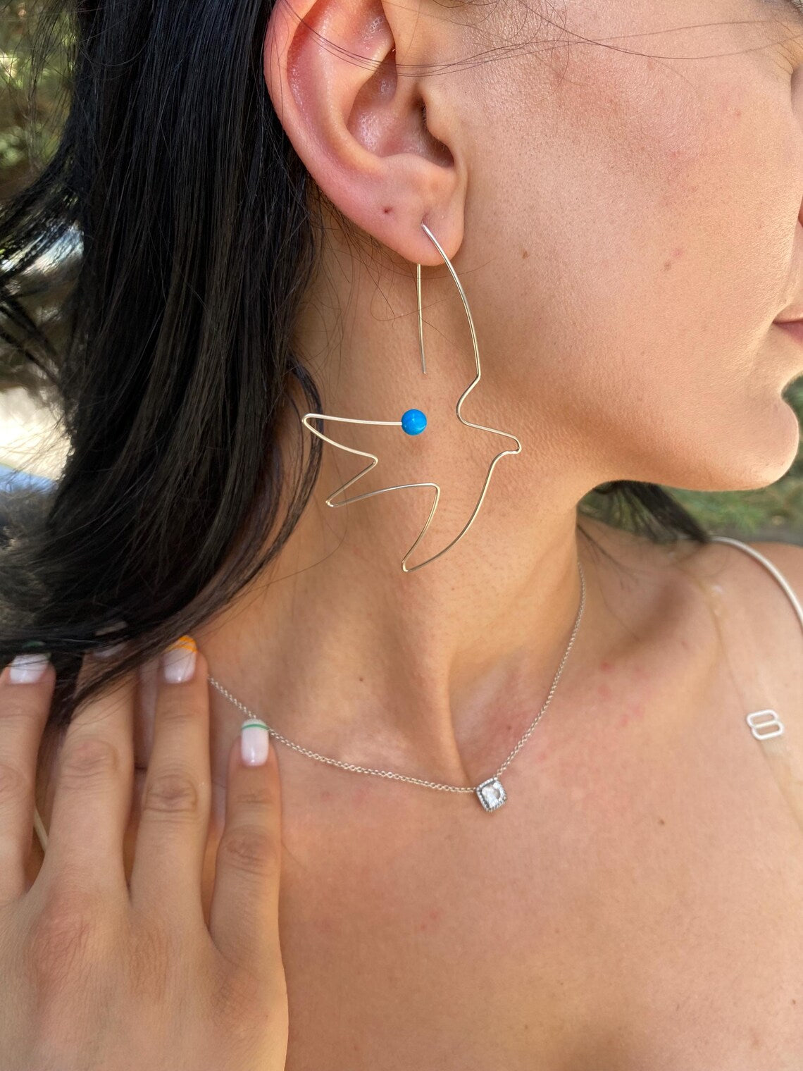 Minimalist wire bird dangle earrings made from sterling silver
