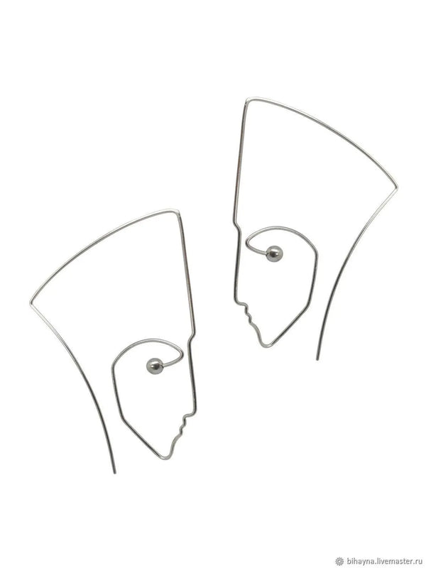 Artistic sterling silver statement earrings with abstract face design