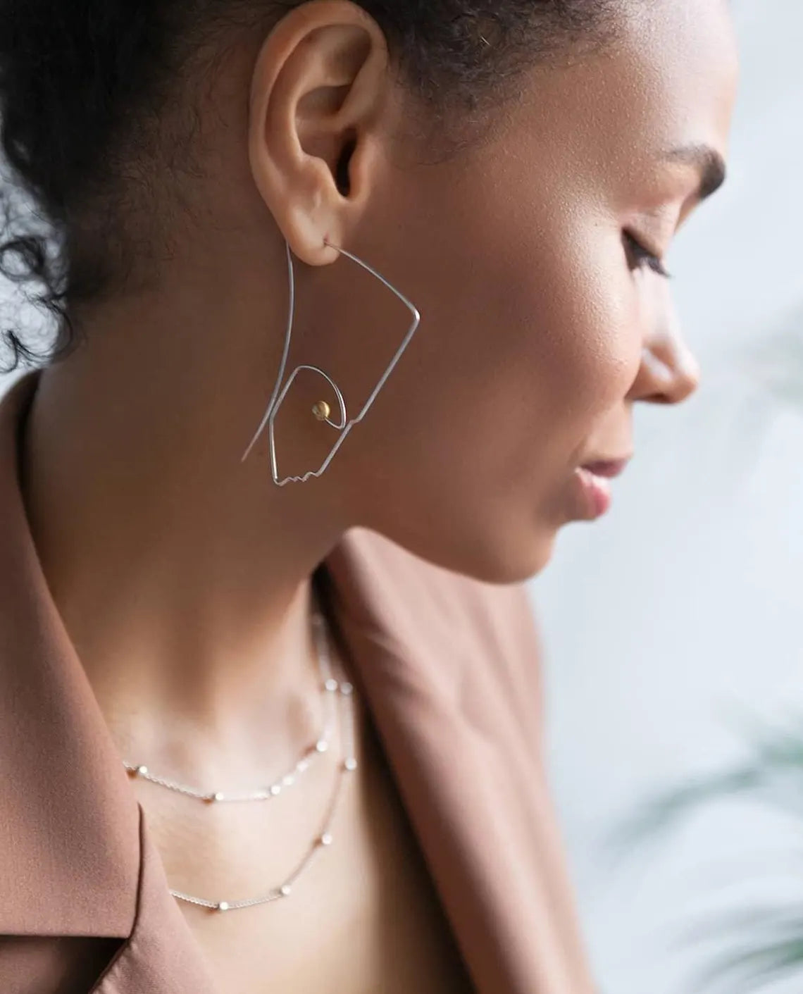 Handcrafted sterling silver Nefertiti line art earrings