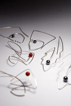 Handmade sterling silver fish earrings detail