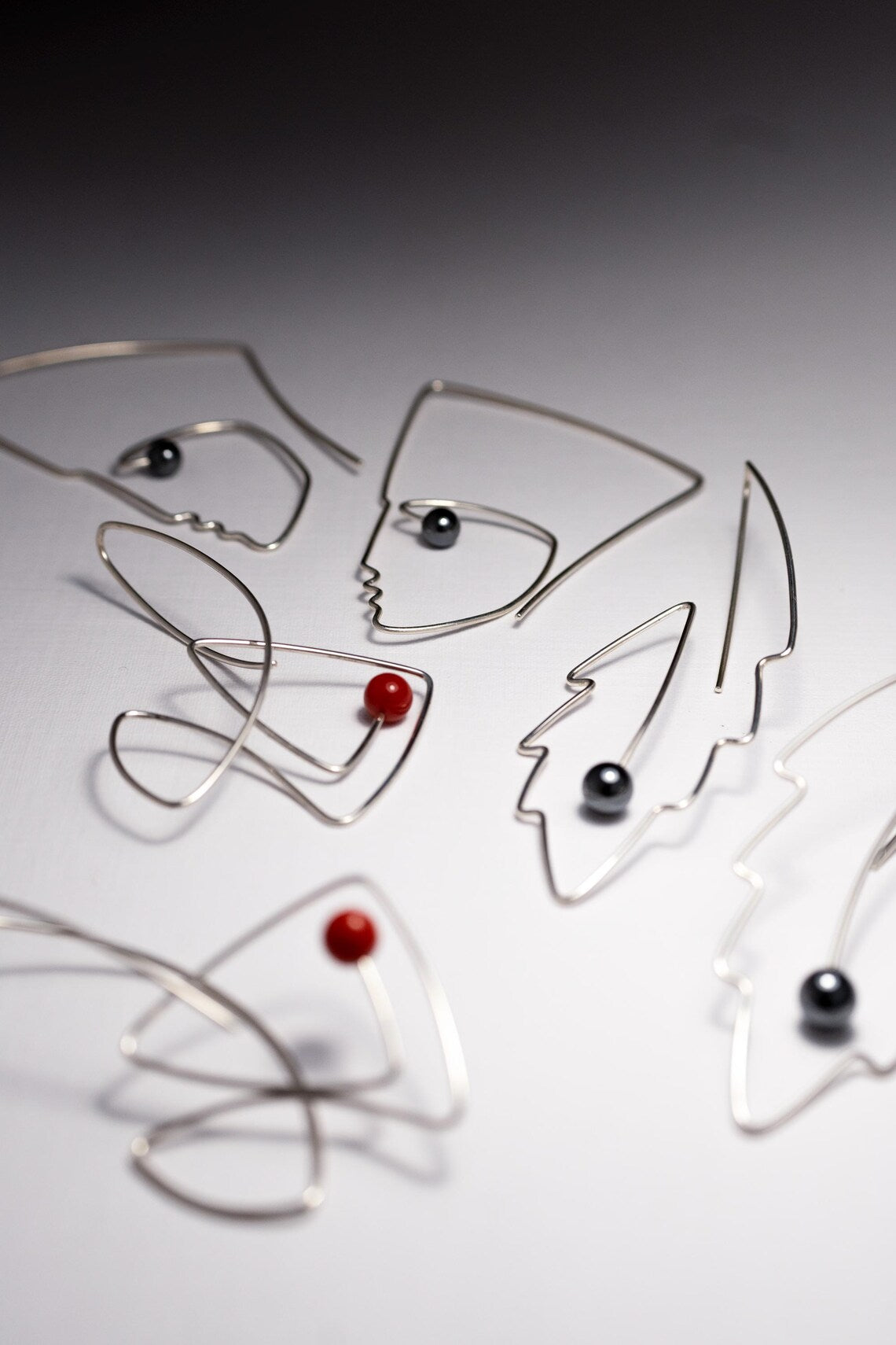 Handmade sterling silver fish earrings detail