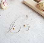 Asymmetrical music note earrings with pearl accents