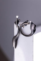Sculptural oxidized sterling silver earrings with pearl accents