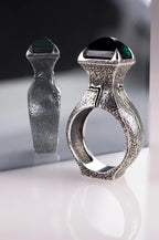 Sterling silver face ring with green gemstone
