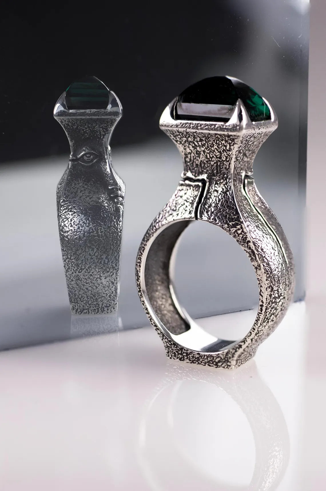 Sterling silver face ring with green gemstone